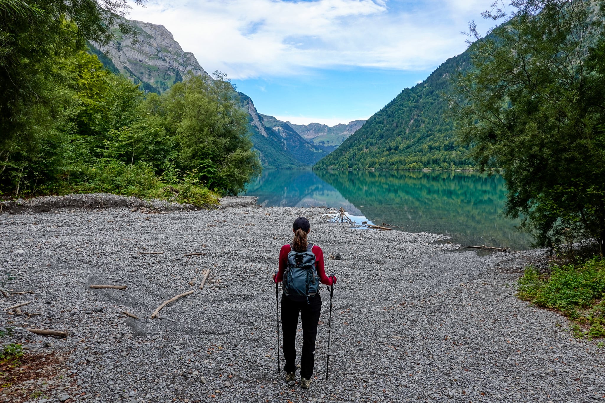 Beck looks towards a lake during a walk called Klöntalersee Rundweg