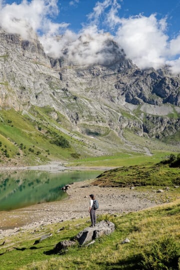 Beck stands by an Alpine lake during the Oberblegisee Hike