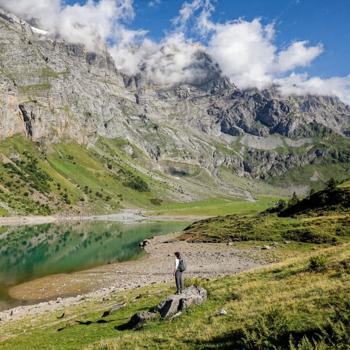Beck stands by an Alpine lake during the Oberblegisee Hike