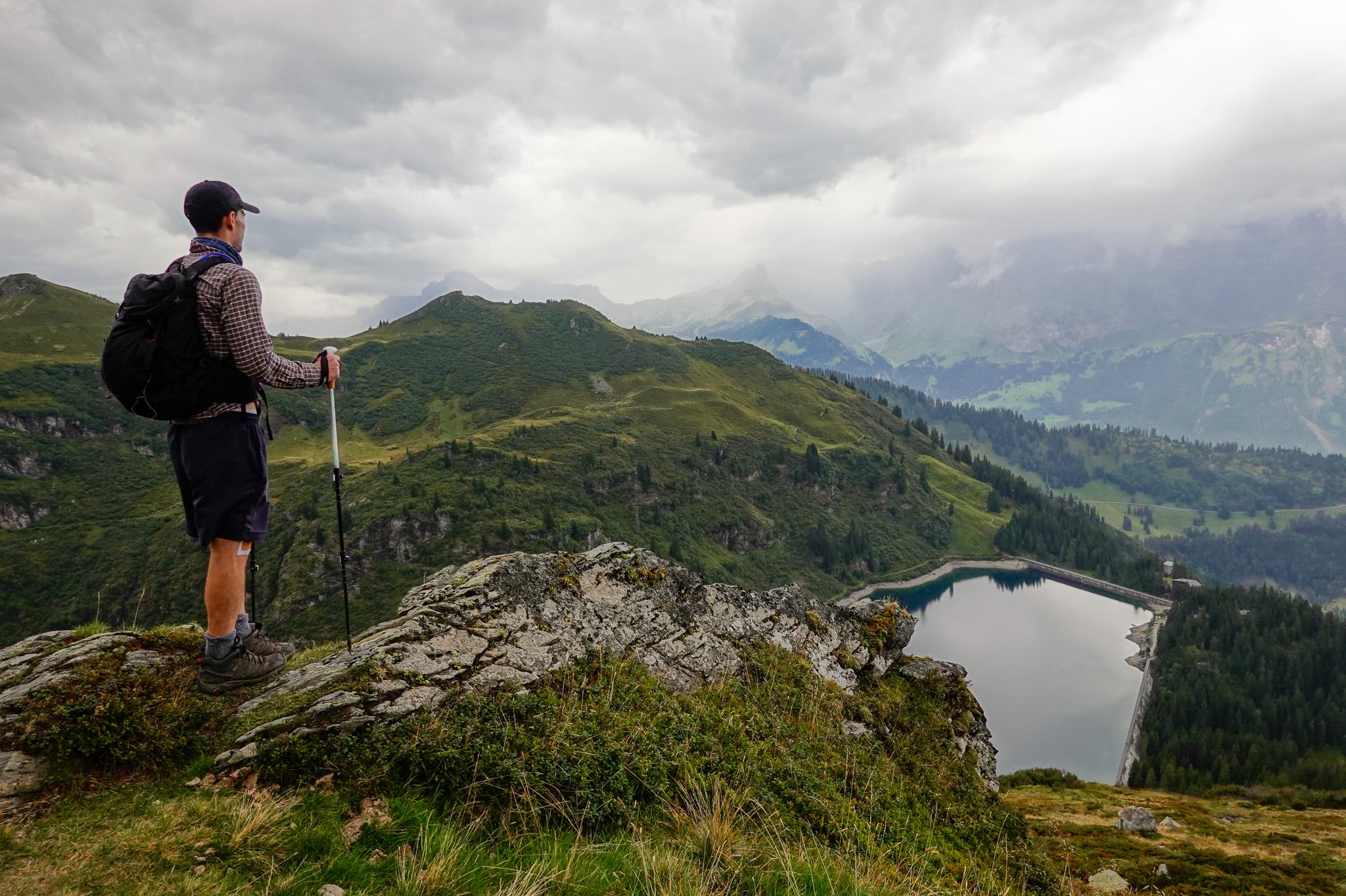 Dan looks at a reservoir during the Kärpfwanderung