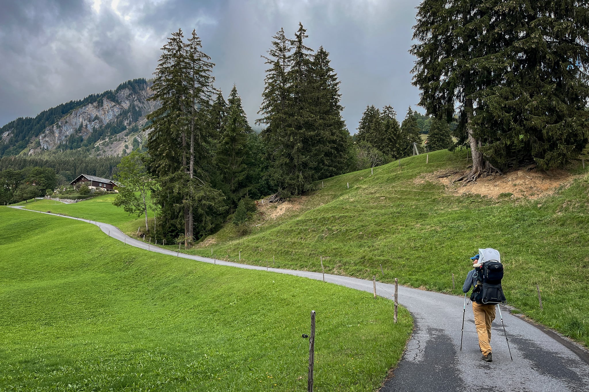 Dan walks on a trail approaching a mountain during a hike called Ahornen Rundweg