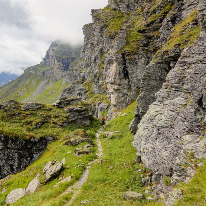 Dan walks in a mountainous landscape during a hike called Kärpfwanderung