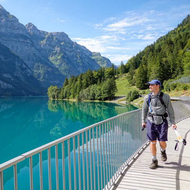 Dan walks by a turquoise lake during a circular walk called the Klöntalersee Rundweg