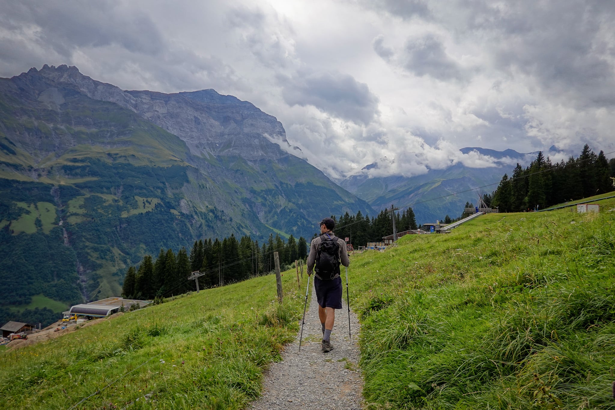 Dan walks along the Kärpfwanderung looking towards mountains