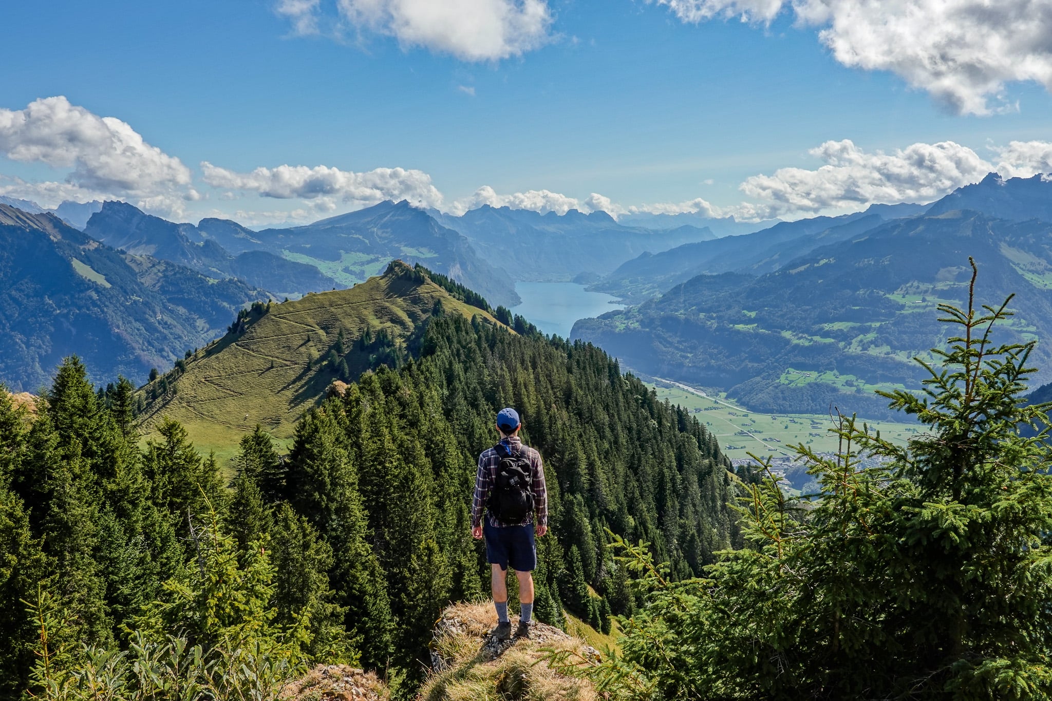 Dan enjoys views of a mountain called Hirzli and lake called Lake Walen from the peak of Planggenstock