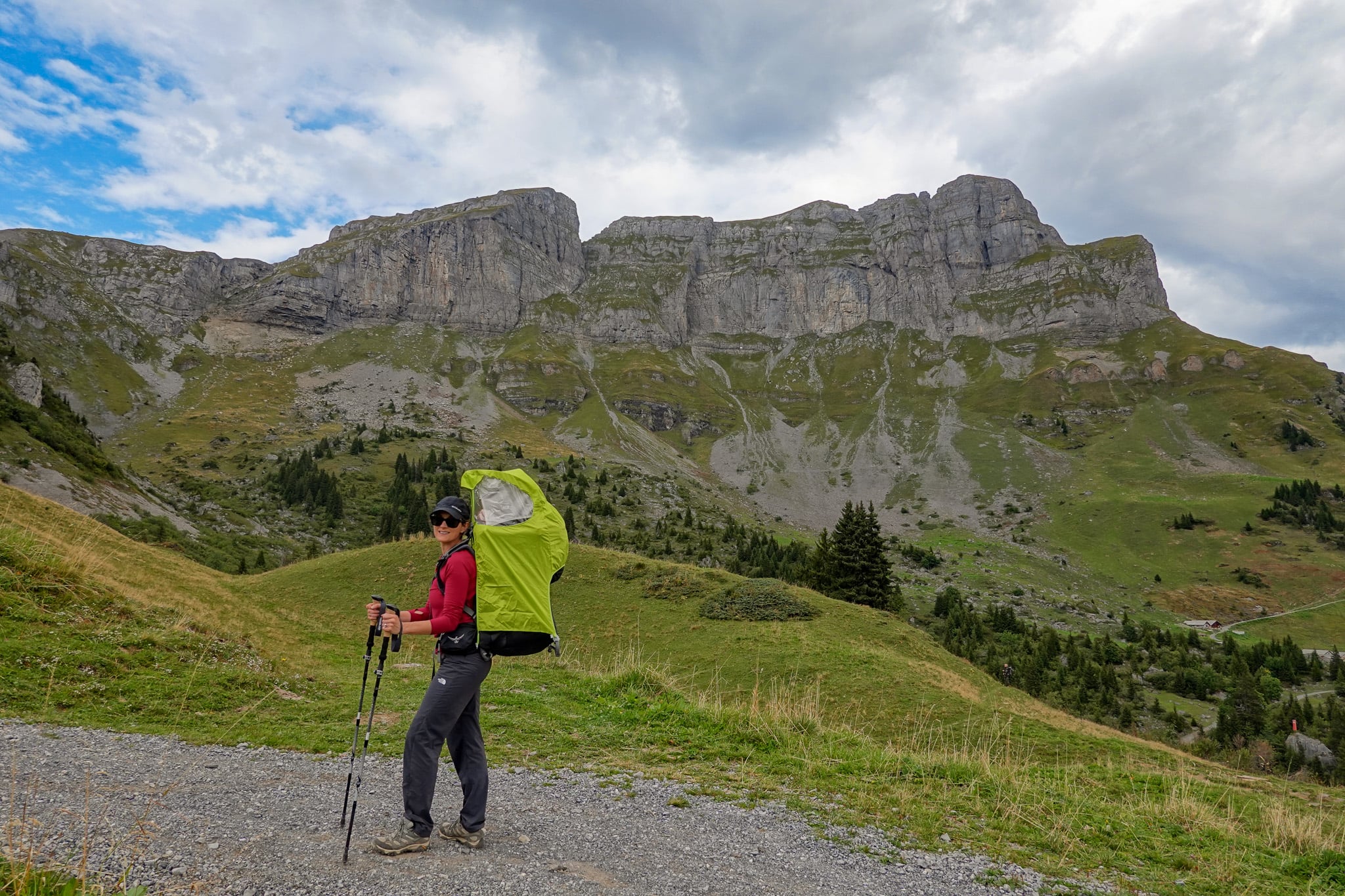 Beck is hiking with a child carrier during the Braunwald Panoramaweg