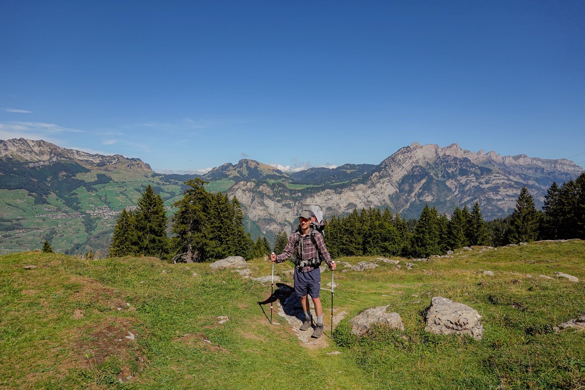 Dan surrounded by mountains during a walk called the Habergschwänd Talalpsee Hike